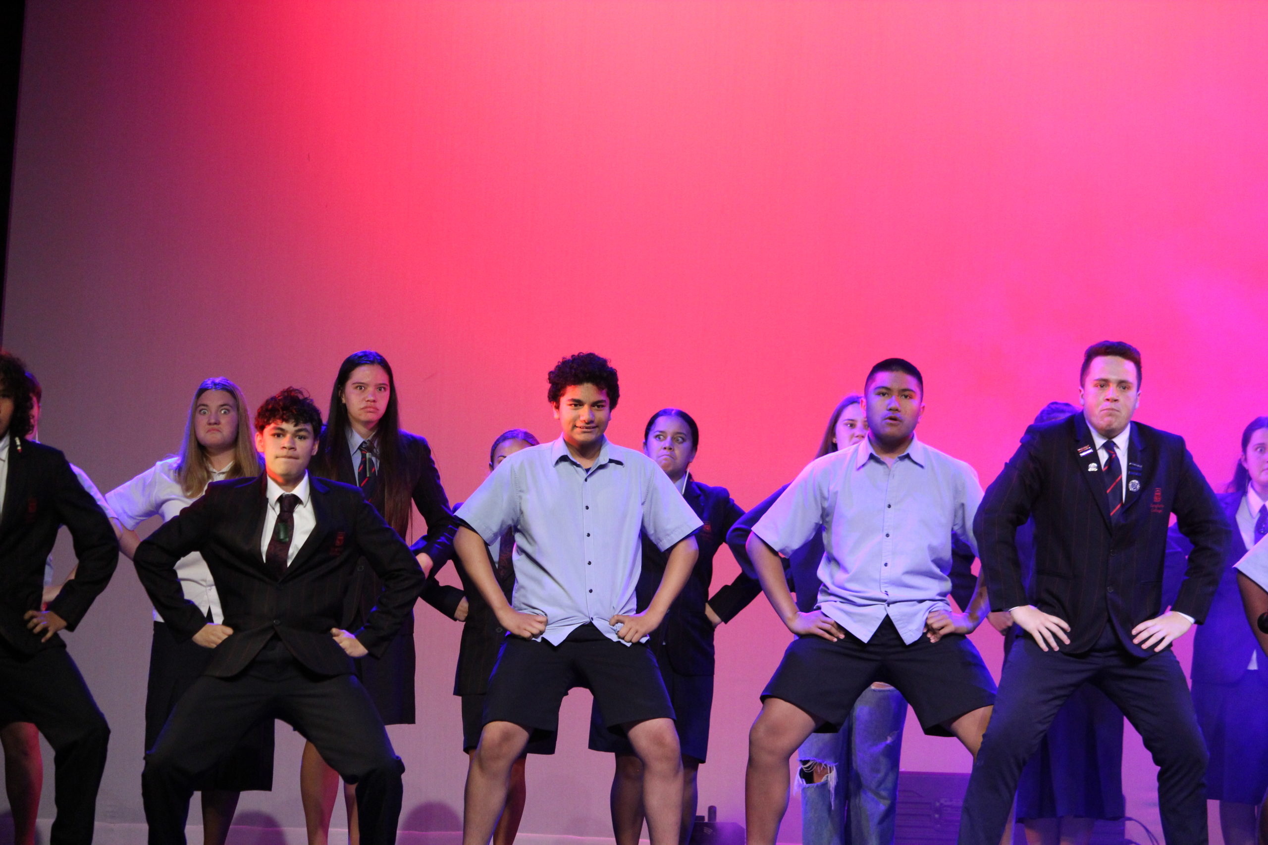 A group of female and male Rangitoto College students presenting a Kapa Haka